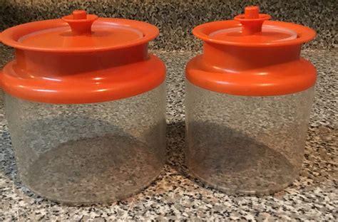 Color: Yellow and rust orange. . Vintage tupperware containers with lids